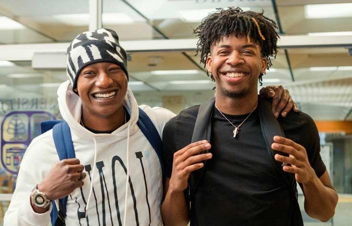 two smiling UB Students